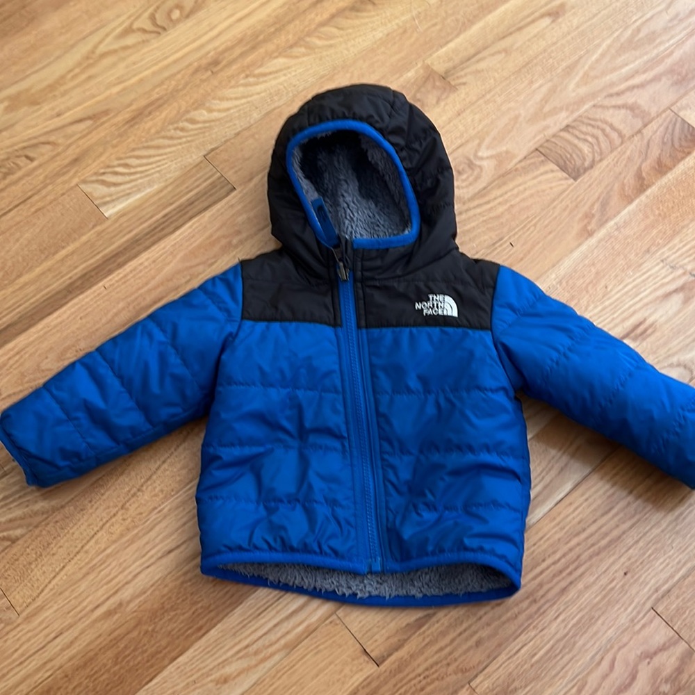 Blue and black north face jacket